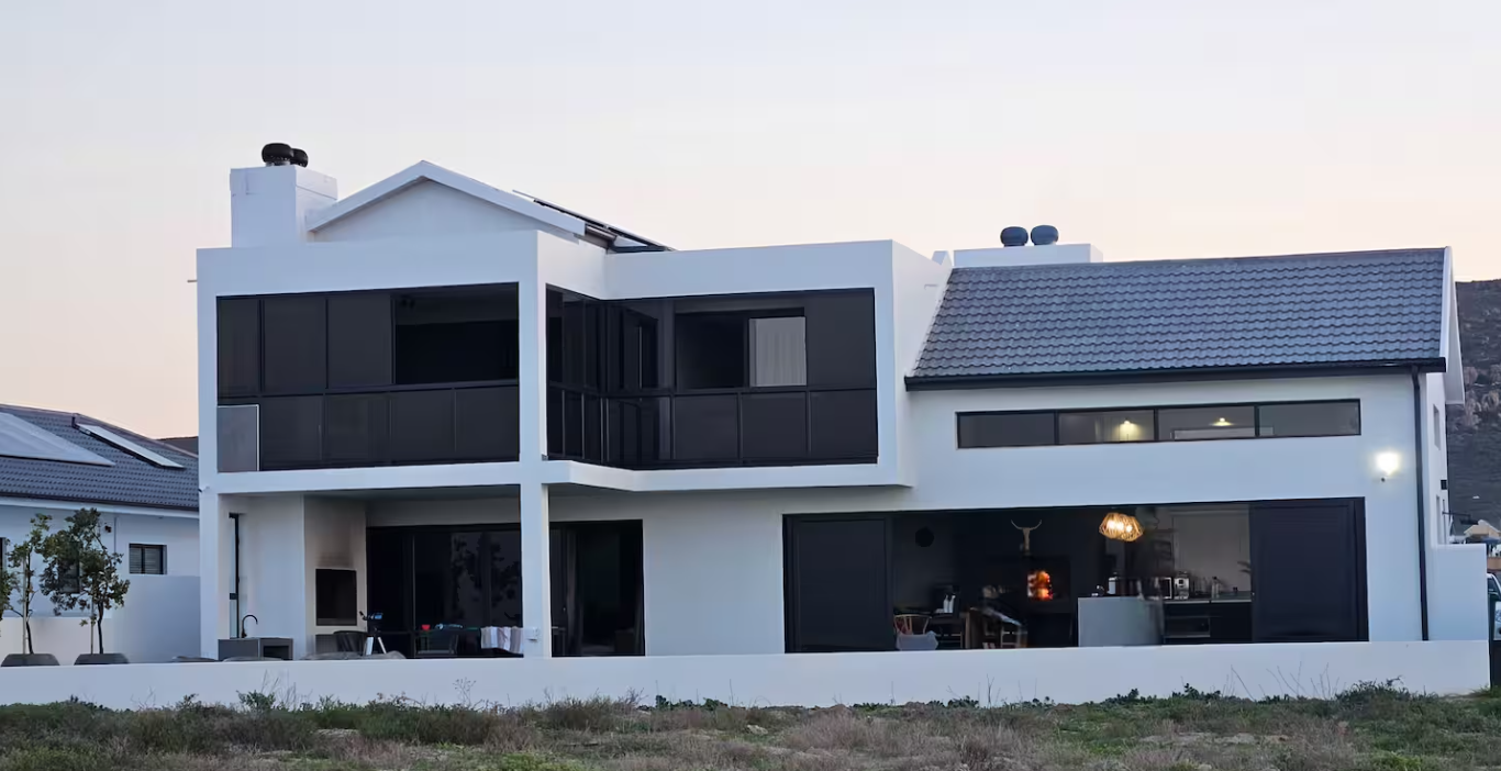 Starfish Beach Villa exterior at dusk in St Helena Bay